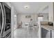 Open dining area adjacent to kitchen with sliding glass door to backyard at 12605 W Dreyfus Dr, El Mirage, AZ 85335