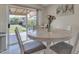 Cozy dining table with backyard view perfect for Gathering meals at 12605 W Dreyfus Dr, El Mirage, AZ 85335