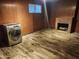 Finished basement with faux wood flooring, fireplace, and washer hookups at 12607 N 23Rd St, Phoenix, AZ 85022