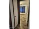 The bedroom is accessible through the hallway door, offering a view of its hardwood floors and window at 12607 N 23Rd St, Phoenix, AZ 85022