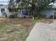 Modest single story home with a large tree that provides plenty of shade in the front yard at 12607 N 23Rd St, Phoenix, AZ 85022