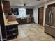 Modern kitchen with stainless steel appliances, updated cabinets, tile floors and large window at 12607 N 23Rd St, Phoenix, AZ 85022