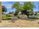 Backyard featuring putting green, built-in grill, outdoor fire pit and desert landscaping at 13034 N 69Th St, Scottsdale, AZ 85254