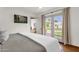 Light filled main bedroom with doors to a private backyard at 13034 N 69Th St, Scottsdale, AZ 85254