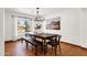 Bright, modern dining room with a decorative chandelier and large window at 13034 N 69Th St, Scottsdale, AZ 85254