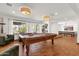 Bright and airy game room with large windows and a classic billiards table at 13034 N 69Th St, Scottsdale, AZ 85254