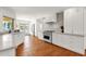 Bright kitchen featuring stainless appliances, white cabinetry and access to the pool at 13034 N 69Th St, Scottsdale, AZ 85254