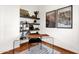 Bright, minimalist office space with glass desk, shelving and decor with natural light, inviting productivity at 13034 N 69Th St, Scottsdale, AZ 85254