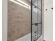 Bathroom with tiled shower and glass enclosure at 13034 N 69Th St, Scottsdale, AZ 85254