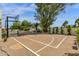 Backyard sport court features basketball net and tennis net at 13034 N 69Th St, Scottsdale, AZ 85254