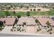 Aerial view of house and golf course community at 13458 W Coronado Rd, Goodyear, AZ 85395