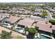 Aerial view of homes featuring a backyard pool and golf course at 13458 W Coronado Rd, Goodyear, AZ 85395