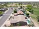Aerial view of homes with backyard pools in golf course community at 13458 W Coronado Rd, Goodyear, AZ 85395