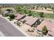 House featuring desert landscaping and golf course community at 13458 W Coronado Rd, Goodyear, AZ 85395