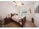 Cozy bedroom with a ceiling fan, hardwood floors, and a serene atmosphere at 13458 W Coronado Rd, Goodyear, AZ 85395