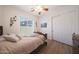 This bedroom has natural light and closet space at 13458 W Coronado Rd, Goodyear, AZ 85395
