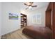 Guest bedroom with built-in shelves and comfortable feel at 13458 W Coronado Rd, Goodyear, AZ 85395
