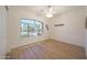 Bright bedroom featuring a large window and neutral decor at 13458 W Coronado Rd, Goodyear, AZ 85395