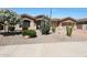 Charming single-story home with a low-maintenance desert landscaped front yard and a three-car garage at 13458 W Coronado Rd, Goodyear, AZ 85395