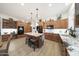 Beautiful kitchen featuring granite countertops, wood cabinets, and a functional center island at 13458 W Coronado Rd, Goodyear, AZ 85395