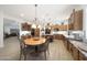Spacious kitchen with wood cabinets, granite countertops, and a cozy breakfast nook at 13458 W Coronado Rd, Goodyear, AZ 85395