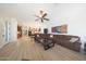 Open-concept living room leading to kitchen with tile floors and an airy design at 13458 W Coronado Rd, Goodyear, AZ 85395