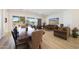 Bright living room with a dining area, comfortable seating, and a view of the backyard at 13458 W Coronado Rd, Goodyear, AZ 85395