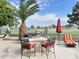 Outdoor kitchen and grill area with a built-in grill, seating, and landscaping at 13458 W Coronado Rd, Goodyear, AZ 85395