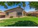 Backyard featuring green lawn and desert landscaping at 1424 W Mead Dr, Chandler, AZ 85248