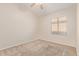 Carpeted bedroom featuring a ceiling fan and window with privacy blinds at 1424 W Mead Dr, Chandler, AZ 85248