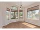 Inviting dining area with large windows providing plenty of natural light and views of the yard at 1424 W Mead Dr, Chandler, AZ 85248