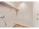 Practical laundry room with tile flooring and shelf at 1424 W Mead Dr, Chandler, AZ 85248