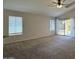 Bright living area with new carpet, slider to backyard, and vaulted ceiling at 1424 W Mead Dr, Chandler, AZ 85248