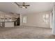 Open-concept living area with a breakfast bar, a modern kitchen, and plenty of room for entertaining at 1424 W Mead Dr, Chandler, AZ 85248