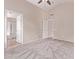 Large main bedroom with carpet, a ceiling fan, and doors to a walk-in closet and ensuite bathroom at 1424 W Mead Dr, Chandler, AZ 85248