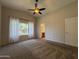 Spacious bedroom with carpet, window, and an ensuite bathroom at 1424 W Mead Dr, Chandler, AZ 85248