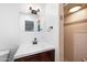 Bathroom featuring a modern vanity with dark wood cabinets, updated fixtures and shower with beige tiling at 1431 E 1St St, Mesa, AZ 85203