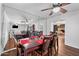 Dining area with hardwood floors, a ceiling fan, and views of the living room at 1431 E 1St St, Mesa, AZ 85203