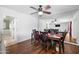 Dining area with hardwood floors, a ceiling fan, and views of the living room at 1431 E 1St St, Mesa, AZ 85203