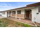 Inviting front porch with decorative columns, stone accents, and a stylish wood front door at 1431 E 1St St, Mesa, AZ 85203