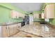 Well-lit kitchen featuring granite counters, modern stainless steel appliances, and convenient access to dining area at 1431 E 1St St, Mesa, AZ 85203