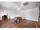 Spacious living area with sleek hardwood flooring, bright white walls, and stylish ceiling fan at 1431 E 1St St, Mesa, AZ 85203