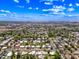Aerial view of the neighborhood with mature trees and city views at 1435 E Rancho Dr, Phoenix, AZ 85014