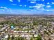 An aerial view of the property's neighborhood, located among mature trees and a blue sky at 1435 E Rancho Dr, Phoenix, AZ 85014