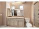 Bathroom featuring a neutral vanity, tiled floors, toilet and a glass shower at 1435 E Rancho Dr, Phoenix, AZ 85014