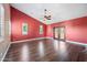 Bright bedroom with hardwood flooring, ample windows, and a ceiling fan at 1435 E Rancho Dr, Phoenix, AZ 85014