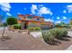 Two-story home featuring a charming front yard, desert landscaping, and a two-car garage at 1435 E Rancho Dr, Phoenix, AZ 85014