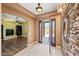 Bright foyer features tile flooring, stone accent wall, and an open view into the living space at 1435 E Rancho Dr, Phoenix, AZ 85014