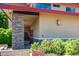 The entrance to this beautiful home is adorned with stone accents and lush landscaping at 1435 E Rancho Dr, Phoenix, AZ 85014