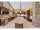 Modern kitchen featuring an island, stainless steel appliances, granite countertops, and custom cabinets at 1435 E Rancho Dr, Phoenix, AZ 85014